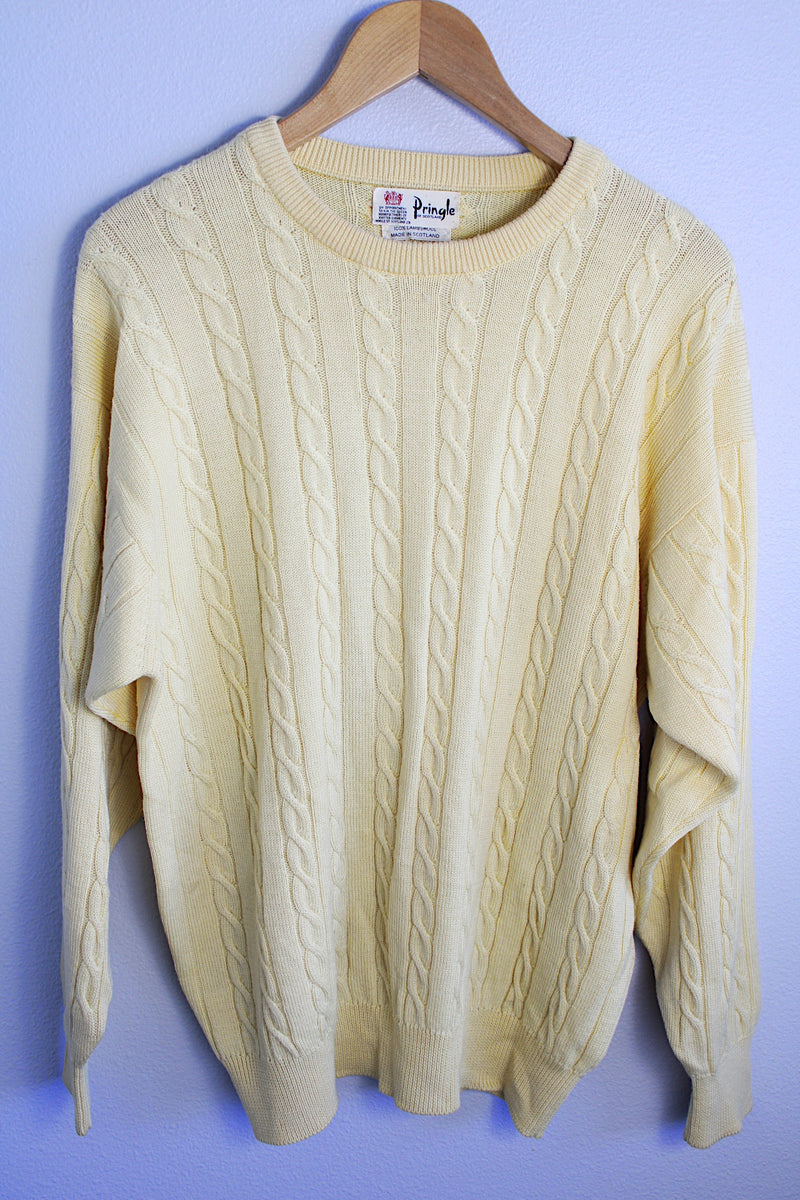 Men's or women's vintage 1960's Pringle label long sleeve pullover sweater in lambswool material. Butter yellow color and all over cable knit texture.