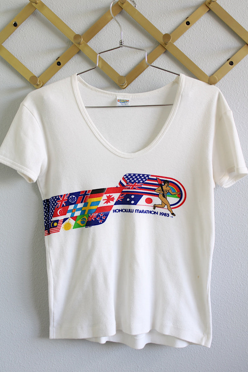 Women's vintage 1980's Crazy Shirt Hawaii, Made in USA label short sleeve white t-shirt with graphic from 1983 Honolulu Marathon on front and back.