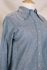 Women's vintage 1970's Maverick, Made in USA label long sleeve light blue chambray button up blouse with a western style.