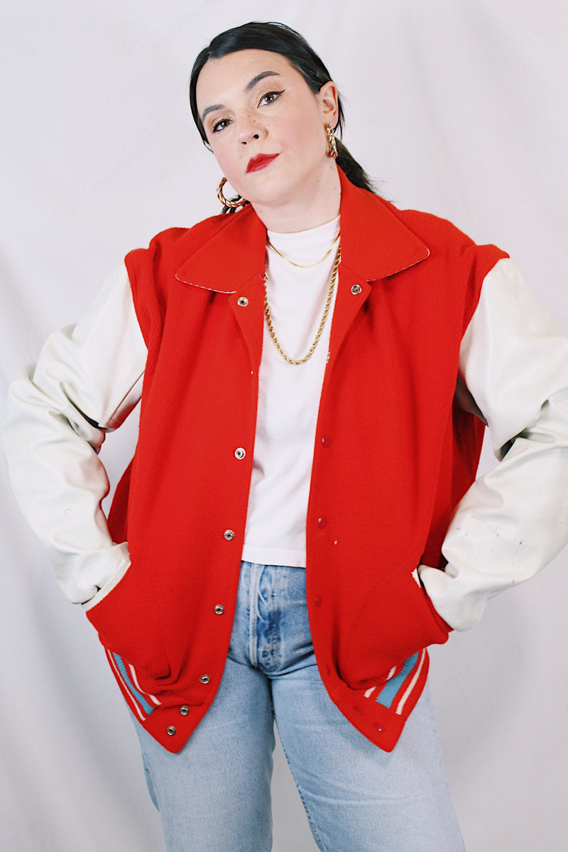 Men's or women's vintage 1960's US Doe-Lon, The Finest Fashion in VINYL label long sleeve red and white varsity letterman jacket with snap buttons and pockets.
