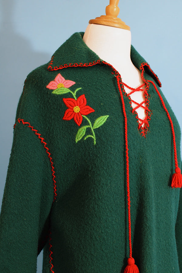 Women's vintage 1970's Indian, Handcrafted by Canadian Indians label long sleeve forest green pullover sweater with a collar and tie front. 