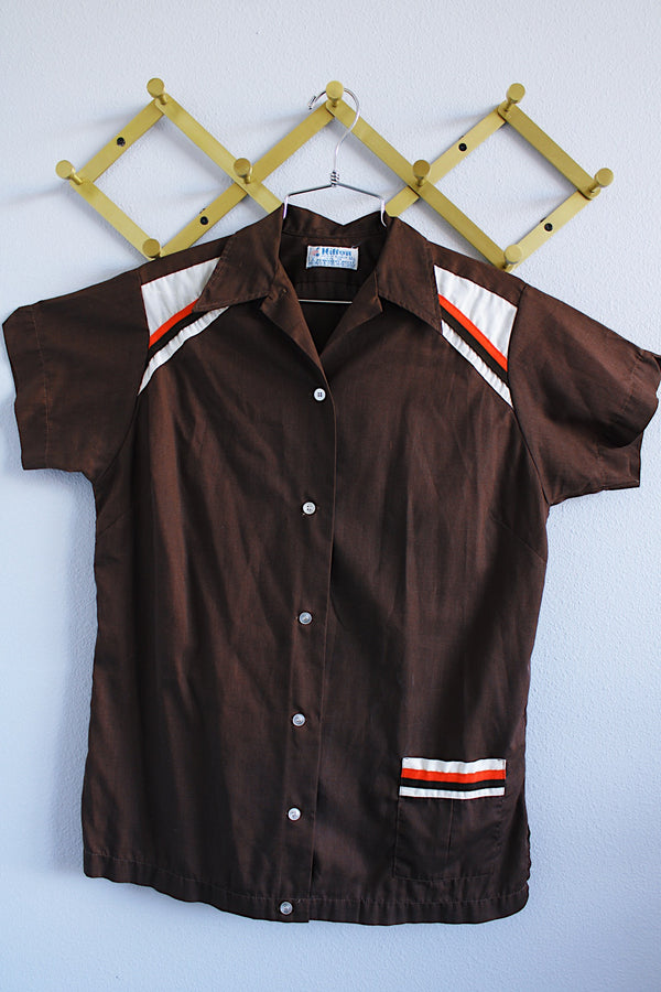 Women's vintage 1970's Hilton, Made in USA label short sleeve chocolate brown button up bowling shirt with collar and cream and orange trim in lightweight cotton material.