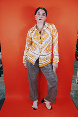 Women's vintage 1970's long sleeve button up blouse with dagger collar, darted bust, and big round clear buttons.