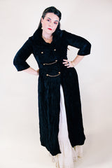Women's vintage 1960's Raymodes, NY label long length long sleeve black velvet duster coat. Bronze buttons with bronze chains.