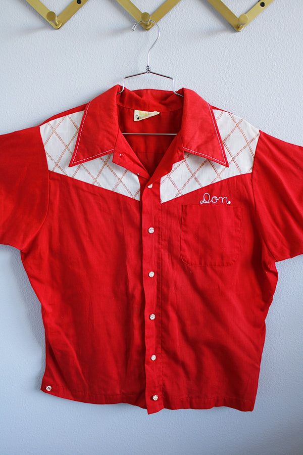 Men's or women's vintage 1970's King Louie label short sleeve red button up bowling shirt. Embroidered name on the front, graphic on the back, white and red striped buttons.