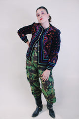 Women's vintage 1980's Saxton Hall, Made in Japan label long sleeve black velvet jacket with all over multicolored print and gold buttons.