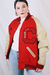 Men's vintage 1987 Nelson's Jackets, Portland, Oregon label long sleeve cream and red colored varsity letterman jacket in wool and nylon material. Has patches and pins.