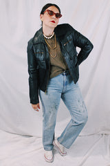 Women's or men's vintage 1970's Genuine Leather, Made in Uruguay long sleeve zip up black leather jacket with brass zippers and four front pockets