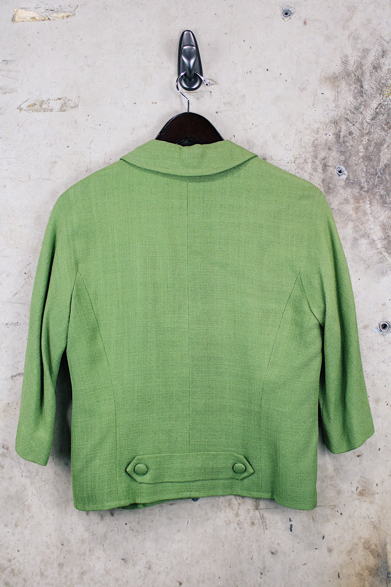 Women's vintage 1960's cropped style green cotton material button up lightweight jacket with 3/4 arm length.