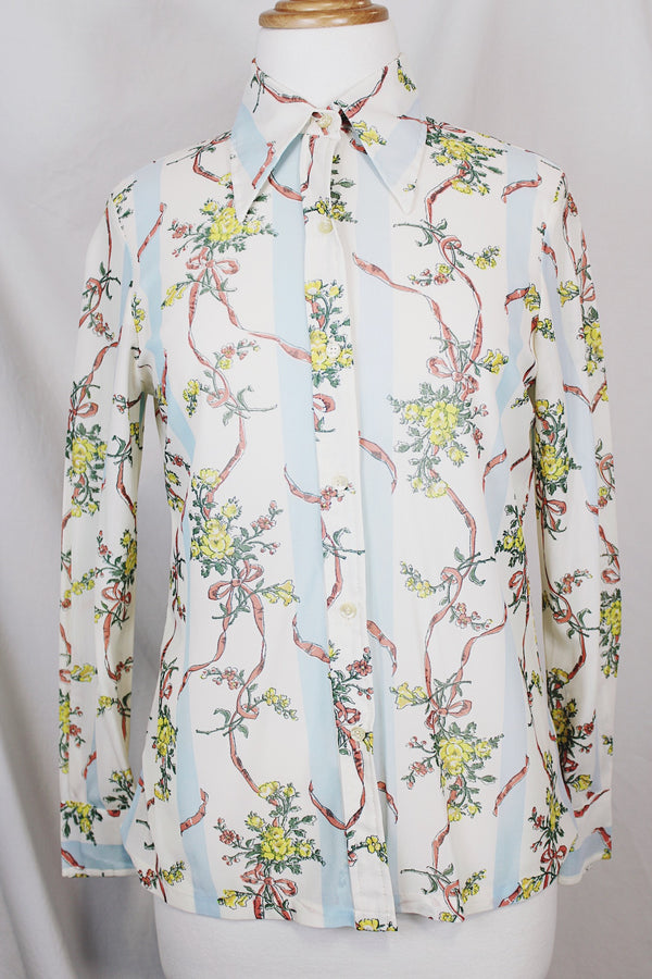 Women's vintage 1970's Knit Editions by Ship 'n Shore long sleeve button up blouse with a dagger collar in an all over white and blue stripes pattern and floral print. 