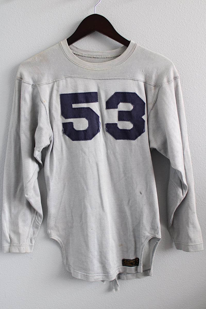 Women's or men's vintage 1960's Southern Manufacturing Co., Quality Athletic Wear, Made in USA label long sleeve sport jersey in light grey with navy letters.
