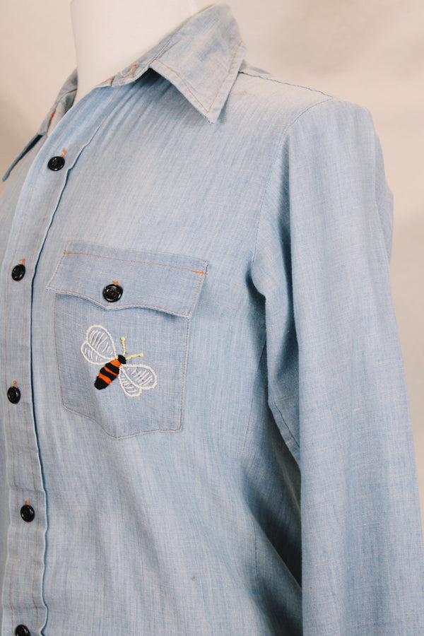 Men's or women's vintage 1970's JCPenney label long sleeve light blue chambray denim shirt with all over colored embroidery. 