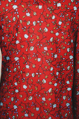 Women's vintage 1970's Donnkenny label long sleeve button up blouse with an attached tie neck. Red with all over blue ditsy floral print. 