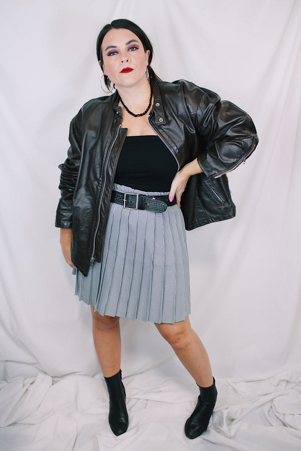 Men's or women's vintage 1980's Kirk's Suede Life label long sleeve oversized dark chocolate brown leather bomber jacket with zipper front closure. 