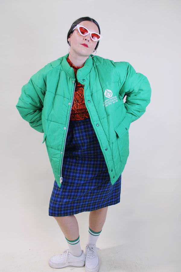Men's or women's vintage 1980's King Louie Pro Fit, Made in USA label long sleeve kelly green puffer jacket with zipper and popper buttons up the front.