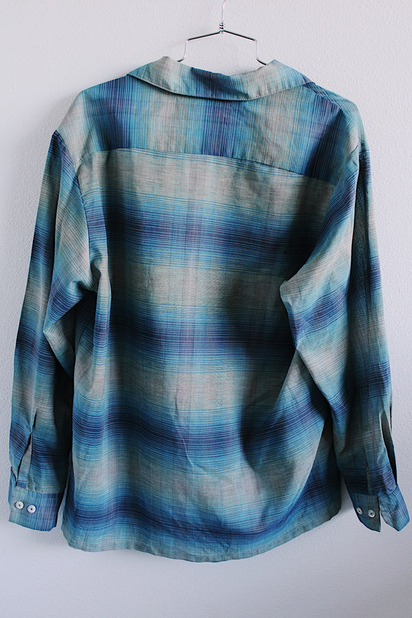 Men's or women's vintage 1960's Sears label long sleeve button plaid shirt in blue and grey colors. One left chest pocket. 