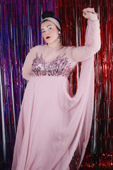 Women's vintage 1980's long sleeve long length pink maxi dress. Has sheer sleeves and sequins across the chest