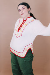 Women's vintage 1970's New Improved Kimlon by RBK Importers label size medium long sleeve white acrylic pullover sweater with half closure and red and yellow trim.