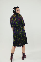 vintage green and purple printed midi dress with slight v neck and 3/4 arm length back