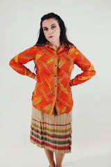 vintage bright orange long sleeve button up blouse with collar green, white, and light orange print front