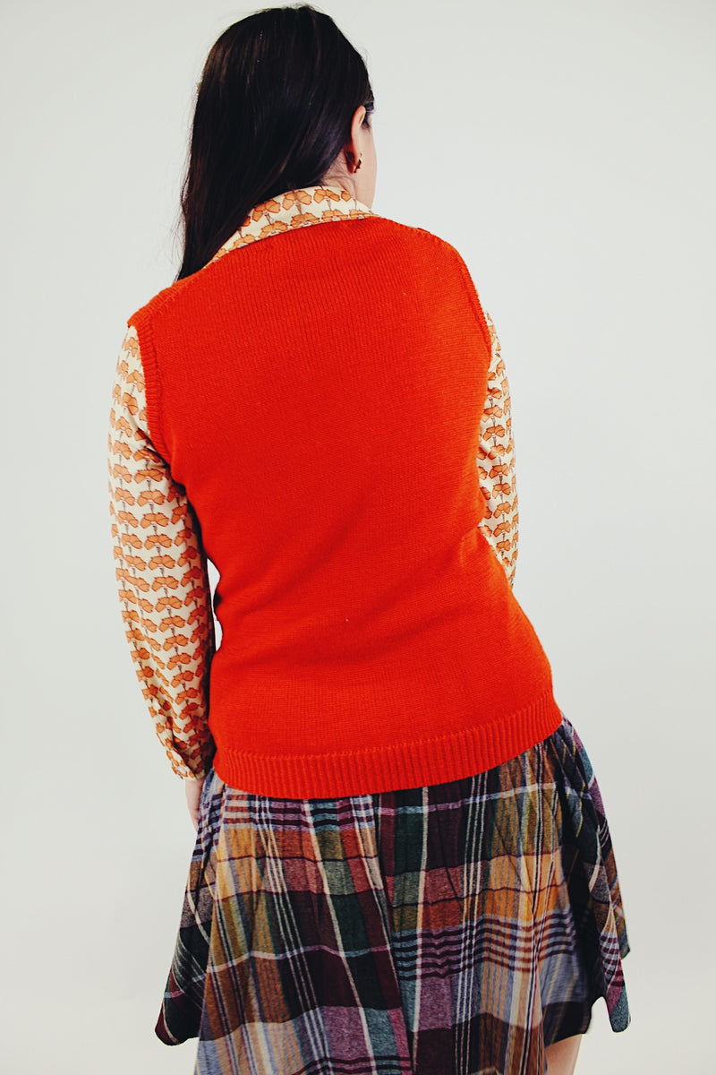 Vintage Orange button up vest with two front pockets and knitted braiding back