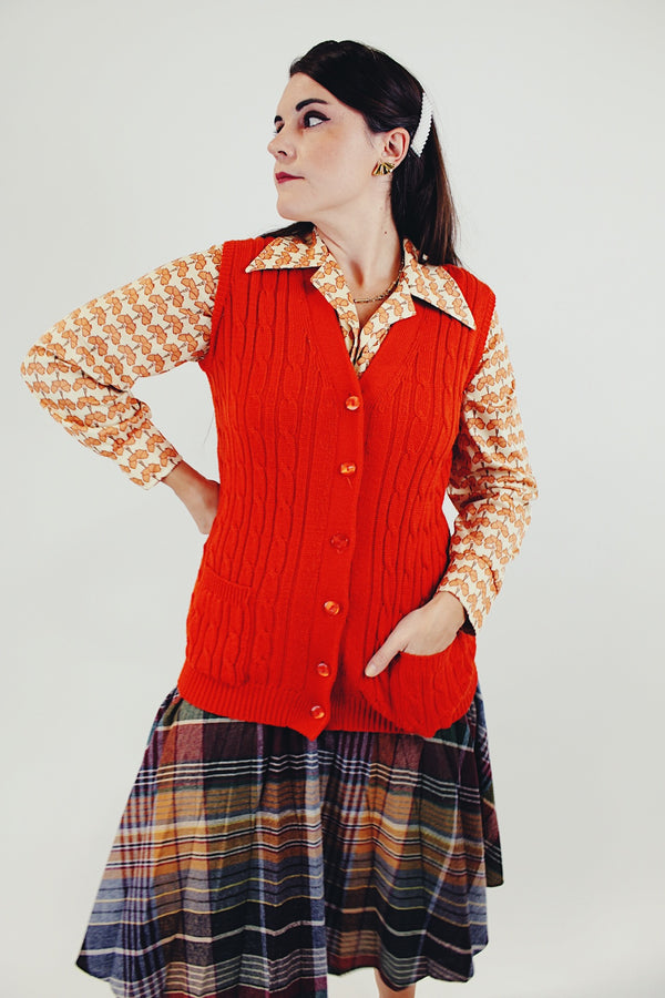 Vintage Orange button up vest with two front pockets and knitted braiding front
