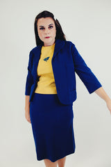 vintage three piece knit set with blue cropped jacket, midi skirt, and sleeveless embroidered top front