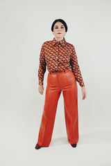 vintage pleather two piece set in burnt orange includes button up collared jacket and high waist pants front just pants