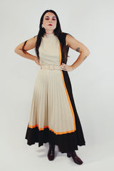 vintage sleeveless pleated dress with small mock neck and matching belt in beige, brown, and orange front