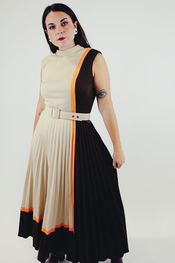 vintage sleeveless pleated dress with small mock neck and matching belt in beige, brown, and orange front