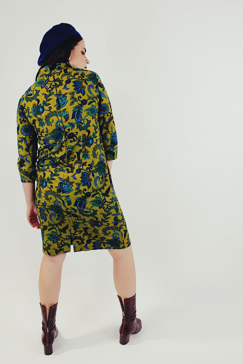 Green and blue paisley printed midi dress with mock neck and 3/4 length sleeves back