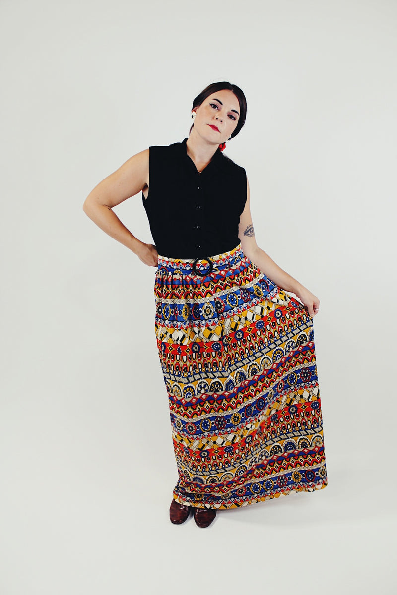 vintage slinky polyester sleeves dress with button up top in black and printed bottom skirt with matching belt front