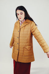 women's brown quilted puffer jacket double lapel front pockets hits above the knee side