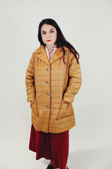 women's brown quilted puffer jacket double lapel front pockets hits above the knee front