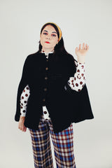 women's vintage black crochet knit poncho with bronze buttons and armholes