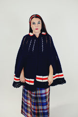 women's vintage navy crochet poncho with red and white stripes around hem with buttons and collar front