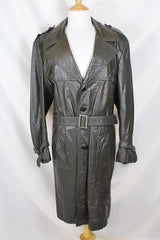  Men's or women's vintage 1970's Made in Argentina label knee length dark grey colored leather trench coat with double lapel and button closure.