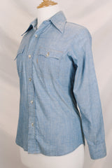 Women's vintage 1970's long sleeve light blue chambray denim shirt with large strawberry print on the back.