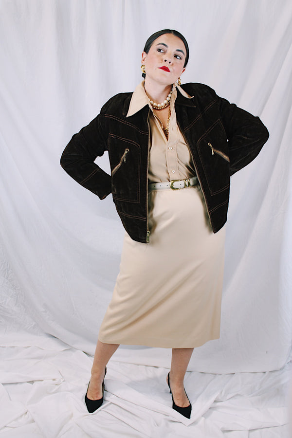 Men's or women's vintage 1970's long sleeve short length chocolate brown jacket in a fuzzy soft suede material. Gold hardware, zipper up the front, contrast stitching, and dagger collar.