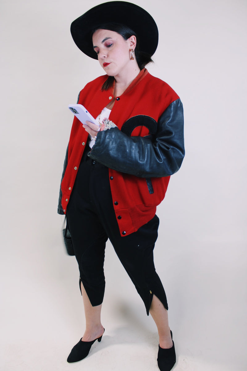 Men's or women's vintage 1970's De Long Sportswear Classics label long sleeve letterman bomber jacket with red wool body and black leather arms.