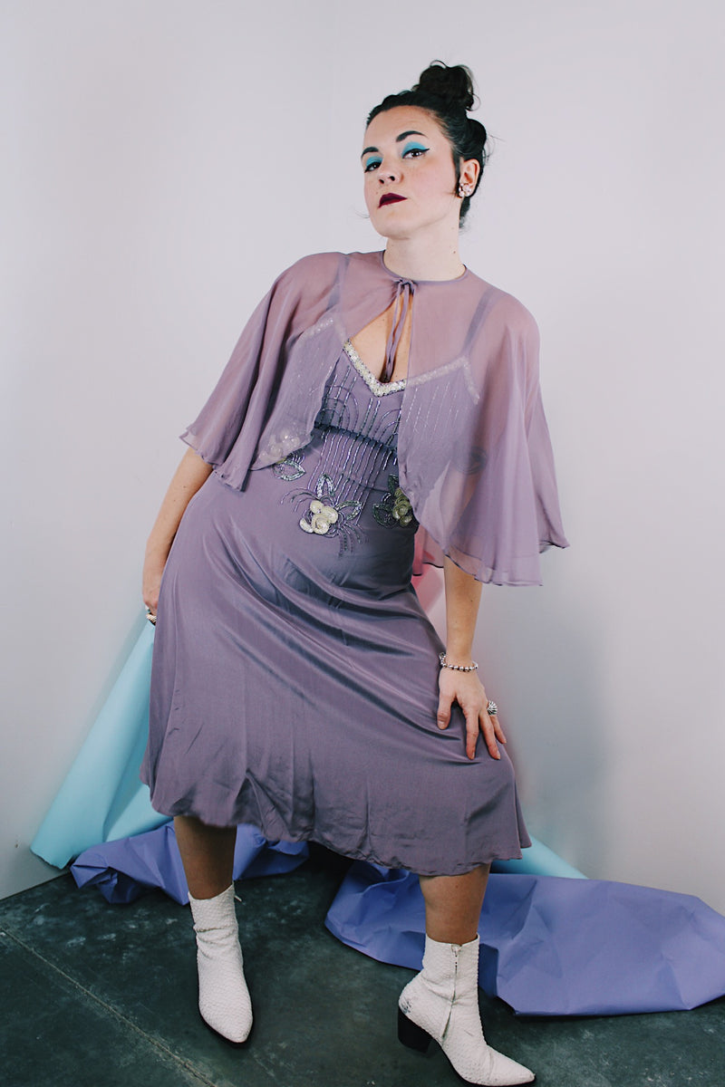 Women's vintage 1980's 100% silk light purple dress with beaded chest, spaghetti straps, V shaped neckline, and a midi length and comes with a matching sheer silk caplet