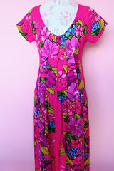 Women's vintage 1960's Skirts & Blouses Specialty Shop Honolulu label short sleeve ankle length bright pink cotton material dress with all over Hawaiian floral print.