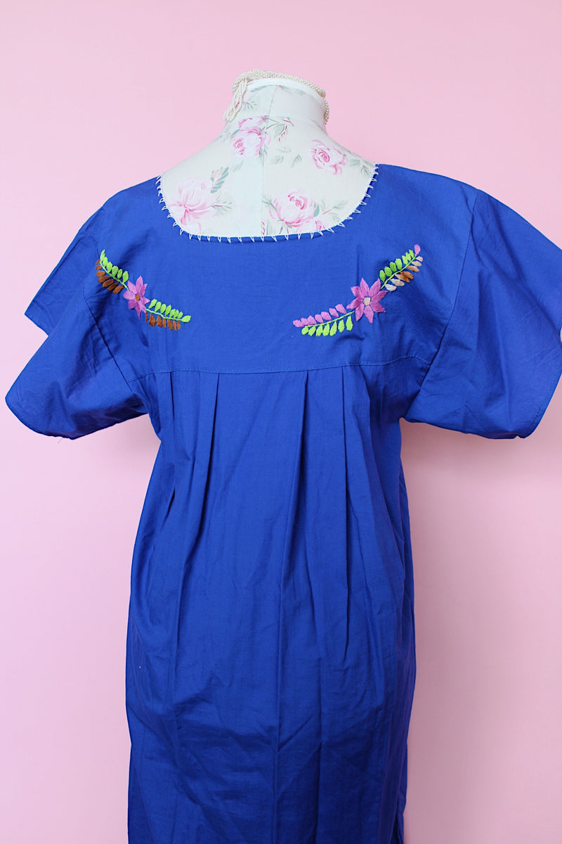 Women's vintage 1970's short sleeve bright blue cotton dress with all over multicolored floral and parrot print embroidery