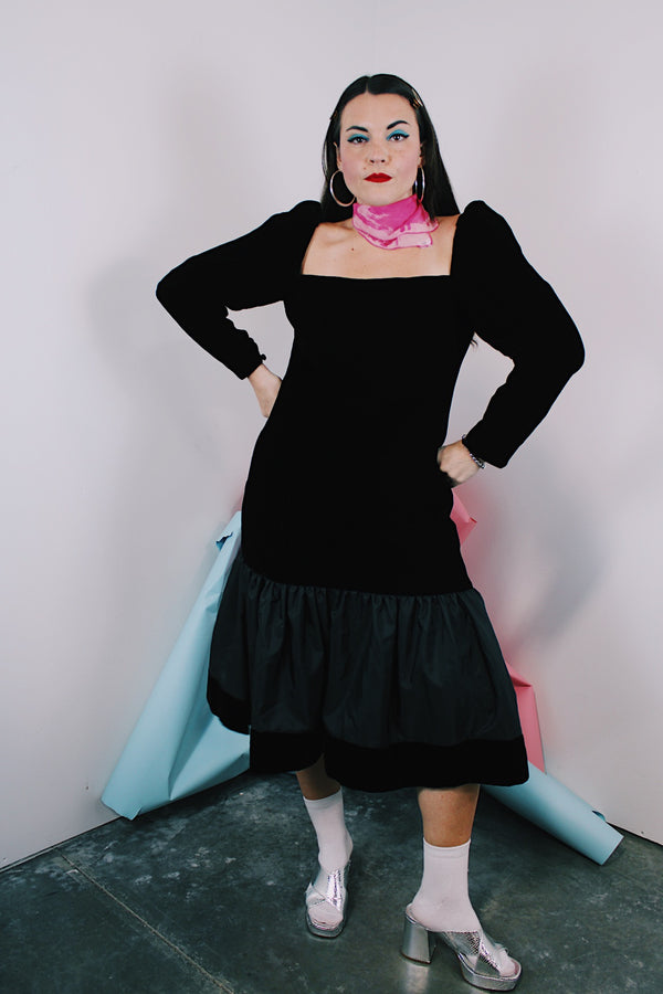 Women's vintage 1980's long sleeve black velvet dress with Polyester peplum skirt bottom