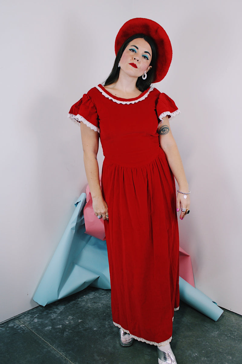 Women's vintage 1970's short sleeve flutter sleeve red velvet ankle length dress with white applique trim. 