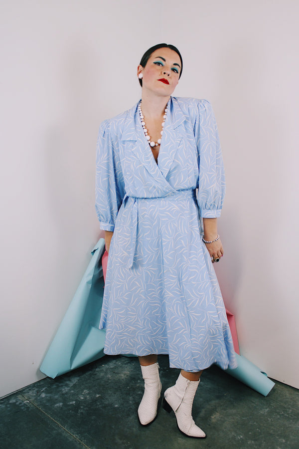 Women's vintage 1980's Argenti Pure label 3/4 arm length baby blue midi length wrap dress with all over white print and a double lapel