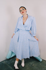 Women's vintage 1980's Argenti Pure label 3/4 arm length baby blue midi length wrap dress with all over white print and a double lapel