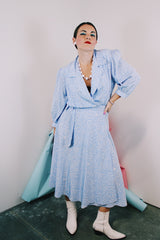 Women's vintage 1980's Argenti Pure label 3/4 arm length baby blue midi length wrap dress with all over white print and a double lapel
