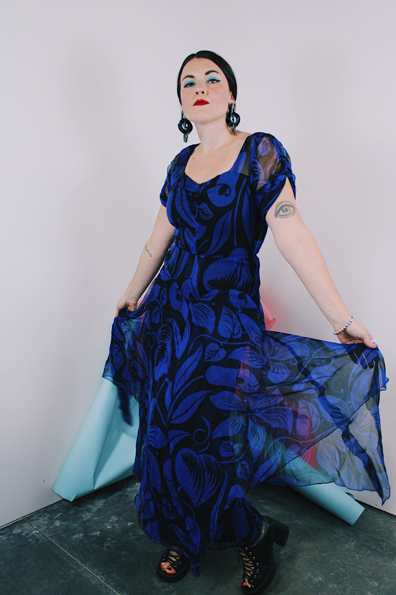 Women's vintage 1940's capped sleeve ankle length dress in black with all over cobalt blue print