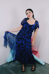 Women's vintage 1940's capped sleeve ankle length dress in black with all over cobalt blue print
